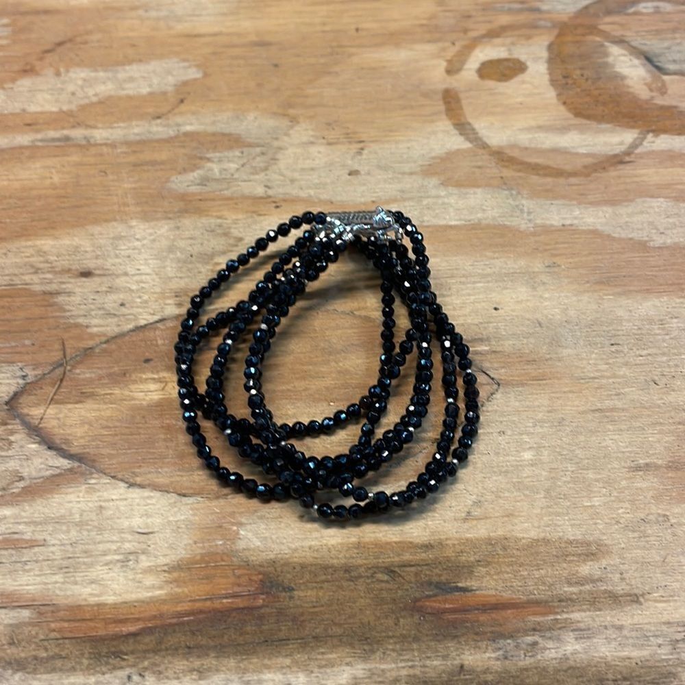 Woman’s black sparkly beaded bracelet
